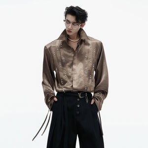 Close up of 3D pleats and pearl embellishments on the sleeve