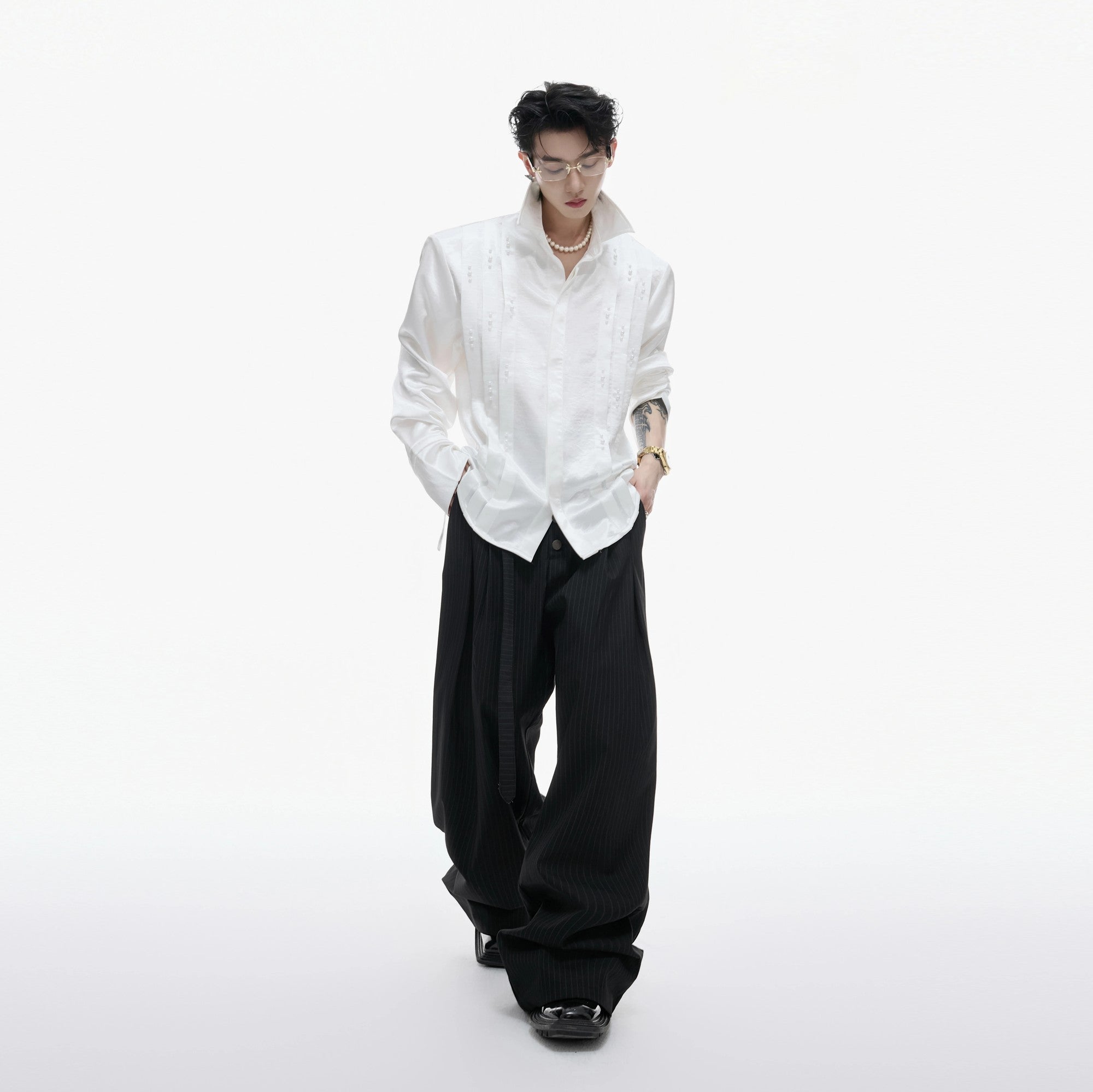 Street style shot of the pleated pearl shirt in an urban setting