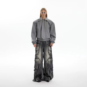 Close-up of stone-washed heavyweight denim fabric and raw edge fringe