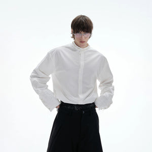 Close up of hand-stitched round pearl buttons on luxury shirt