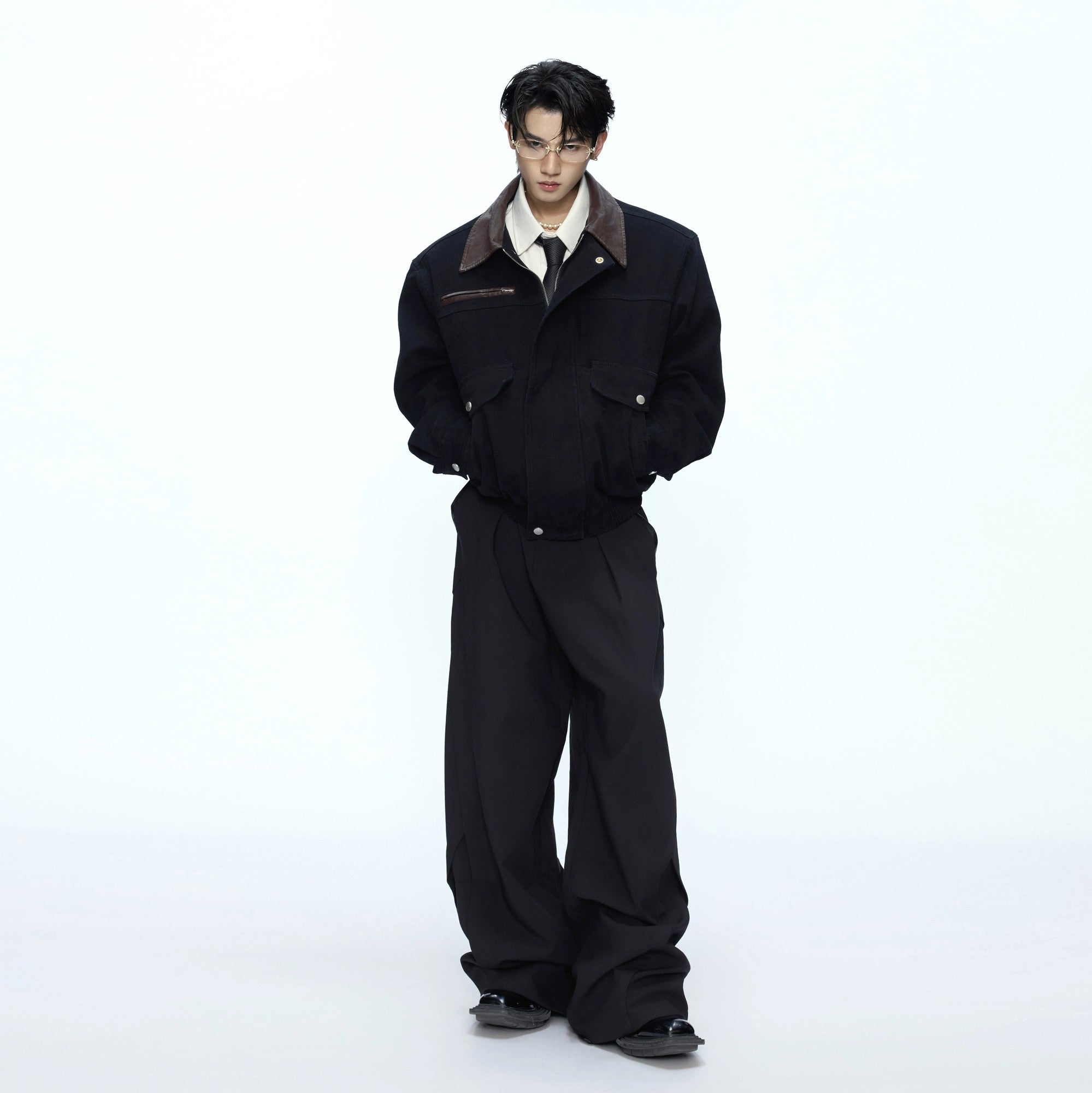 Back view showing the elastic hem and clean silhouette of the jacket