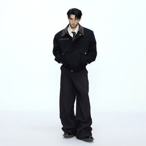 Back view showing the elastic hem and clean silhouette of the jacket