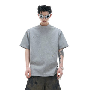 Front view of a white boxy pleated T-shirt for a minimalist look