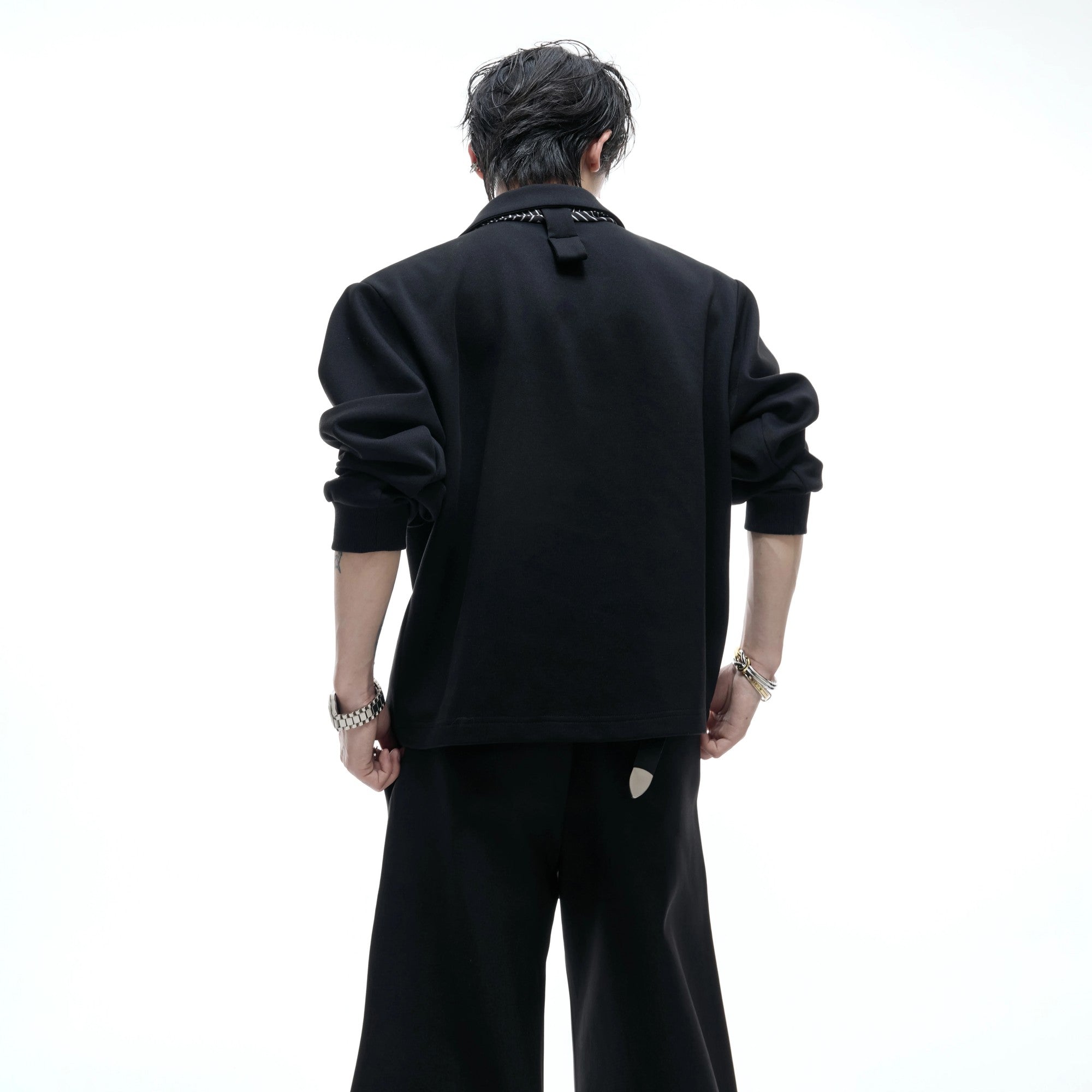 Close up of the detachable striped scarf on polo collar