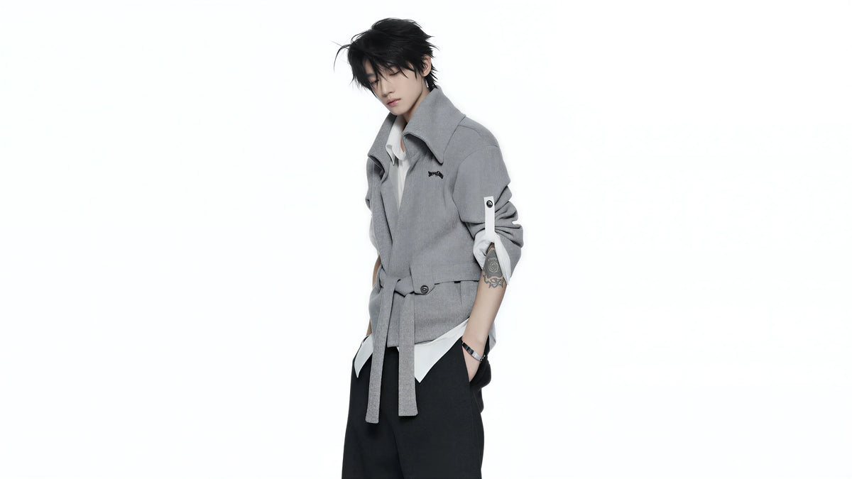 Model wearing a gray belted shirt