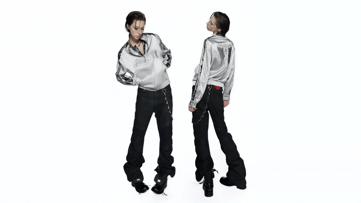 Two models wearing silver shirts and black trousers
