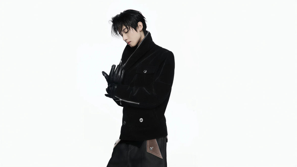 Model wearing a black tailored coat