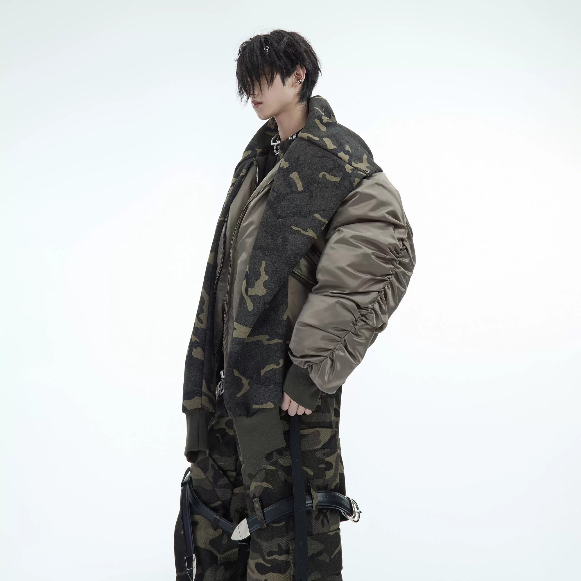 Model wearing beige camo patchwork flight jacket in urban setting