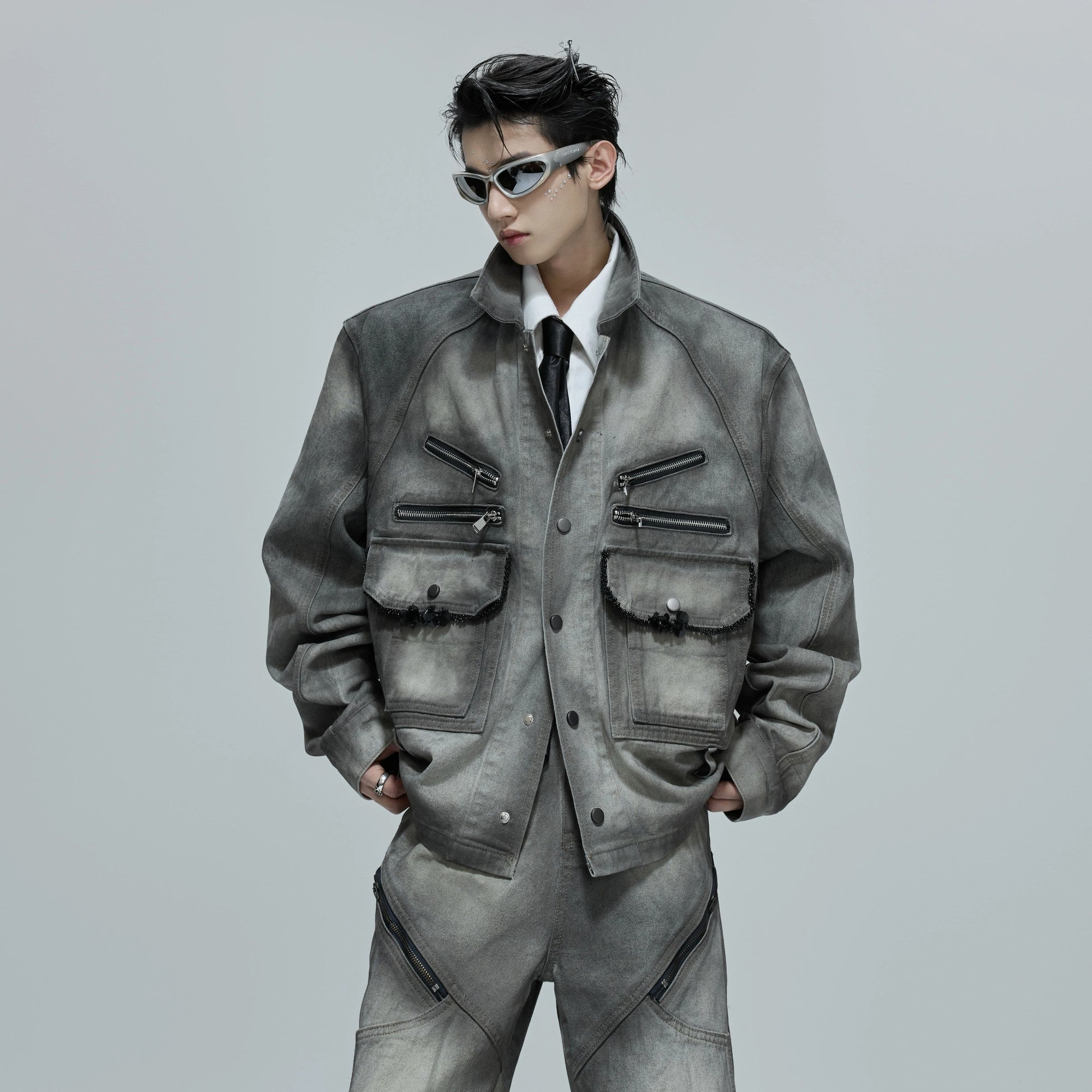 Back view of the cement gray flared denim pants showing the fit.