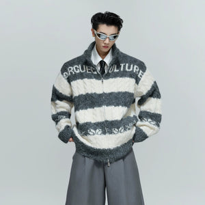 Front view of an oversized chunky knit zip cardigan in contrast black and white.