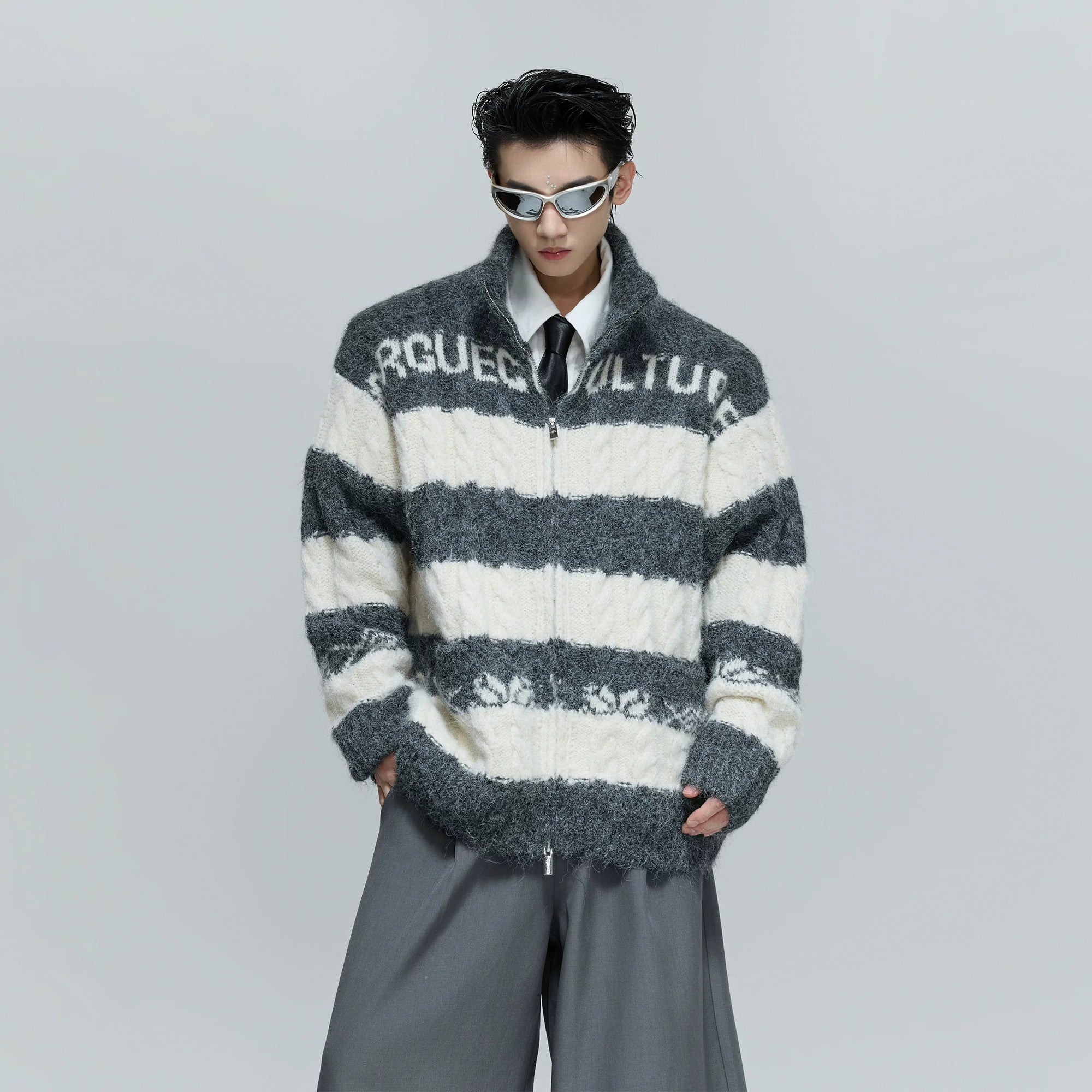 Close-up of the heavyweight wool blend chunky knit fabric texture.