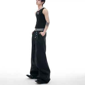 Back view of loose fit trousers showing pocket placement and drape