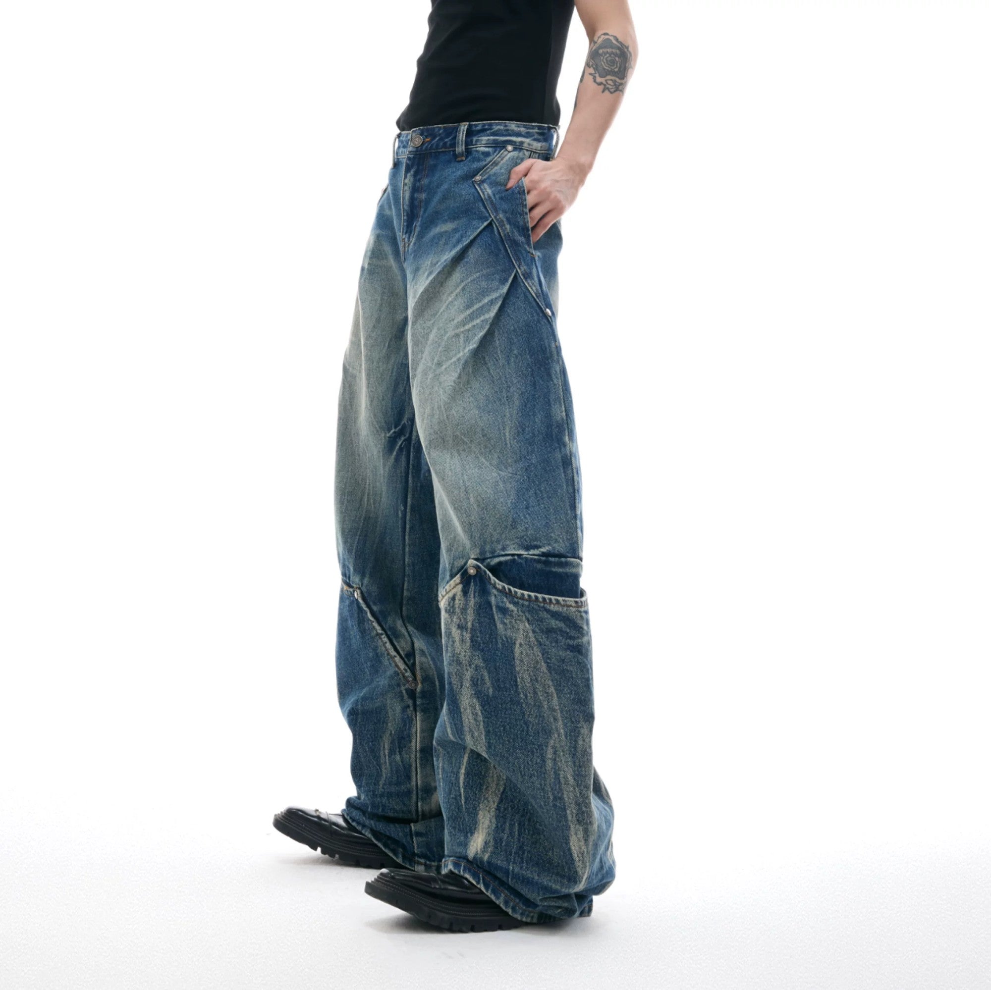 Side view showing the unique curved cut silhouette of streetwear jeans
