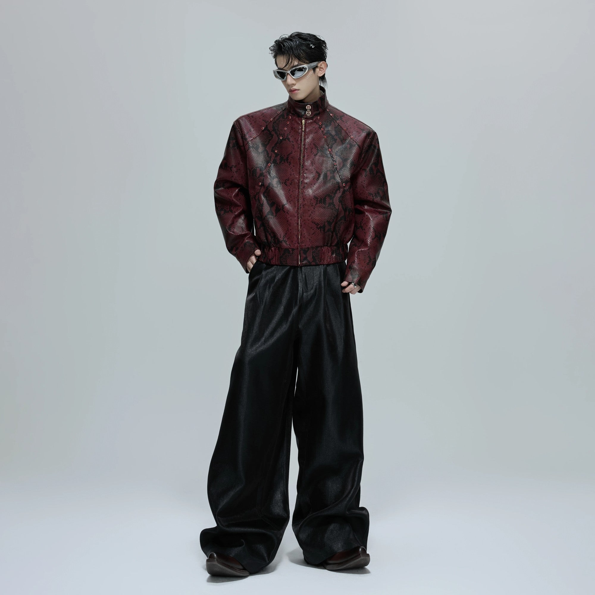 Male model wearing baggy crinkle pants in an urban street setting