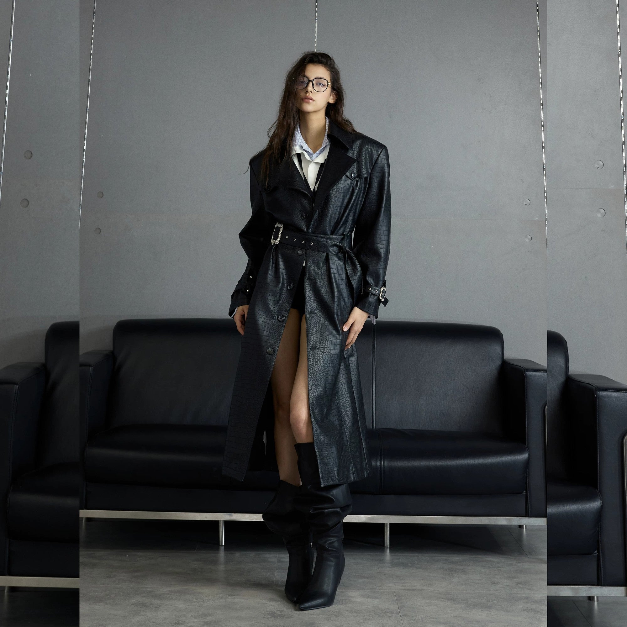 Back detail of deconstructed leather coat with cinched waist