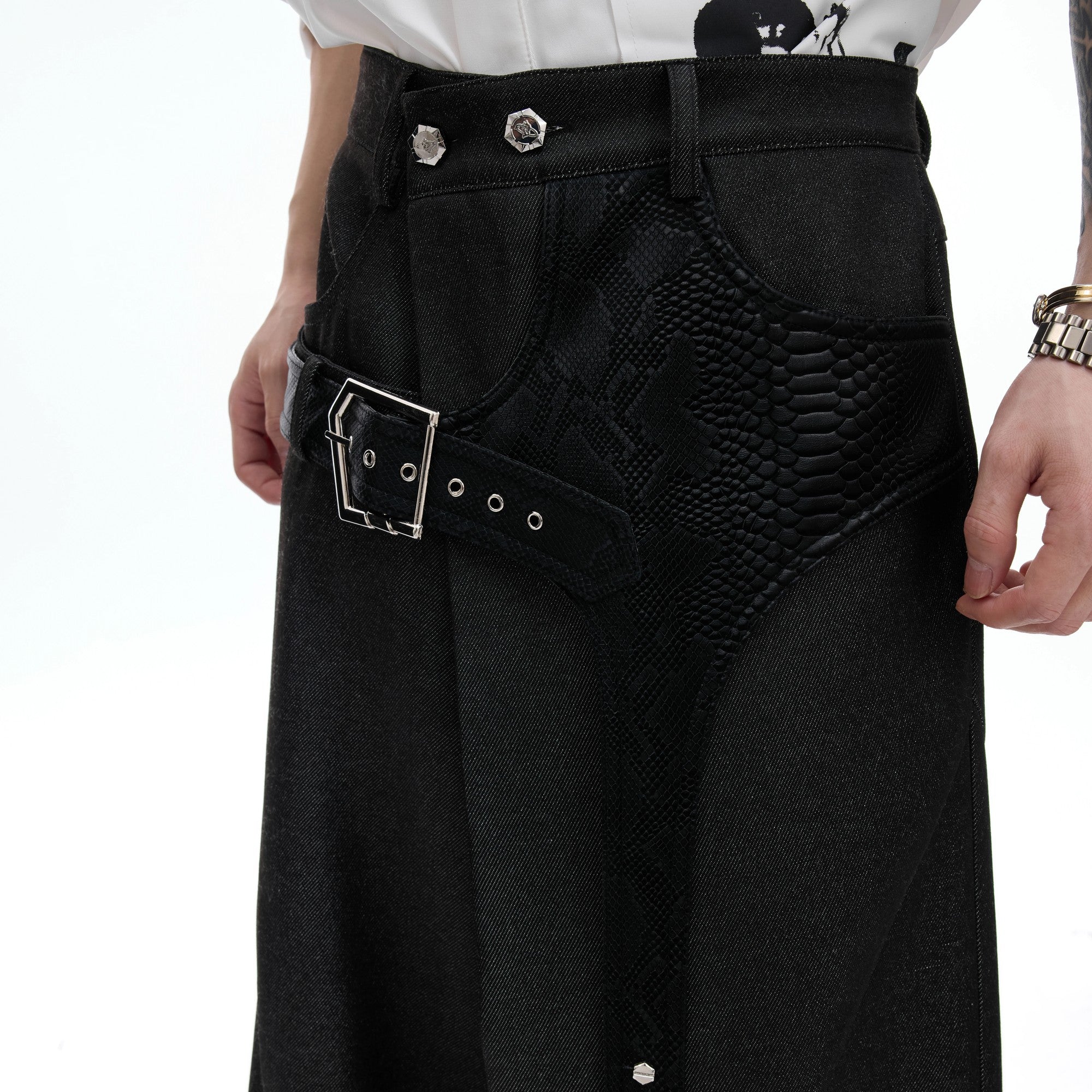 Street style outfit featuring croc-skin patchwork trousers and combat boots.