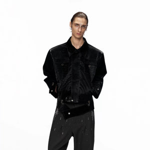 Front view of black cropped croc-embossed leather jacket with metal hardware