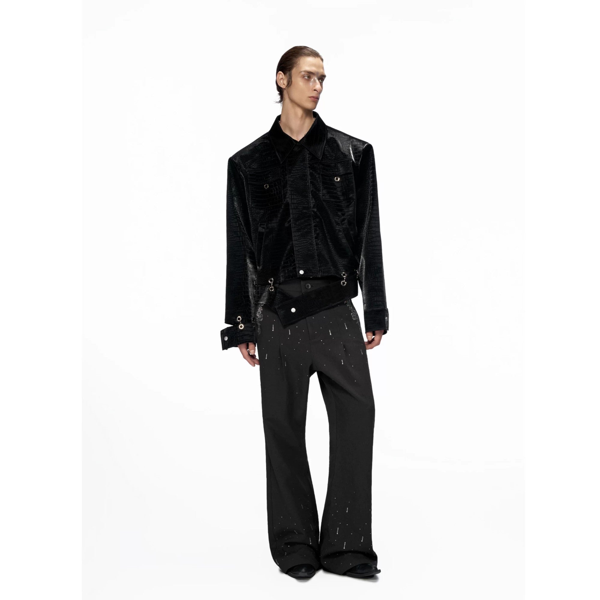 Model wearing cropped croc leather jacket with baggy pants
