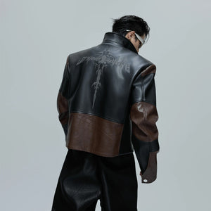 Black cropped moto jacket with crocodile texture and spine design