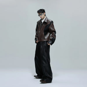 Model wearing cropped crocodile texture jacket in urban setting
