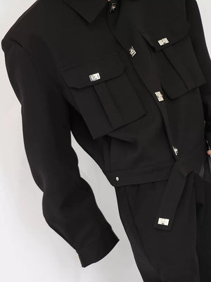 Close up of structured shoulder padding and metal button hardware on jacket