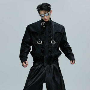 Front view of a cropped snake skin moto jacket with metal buckle details