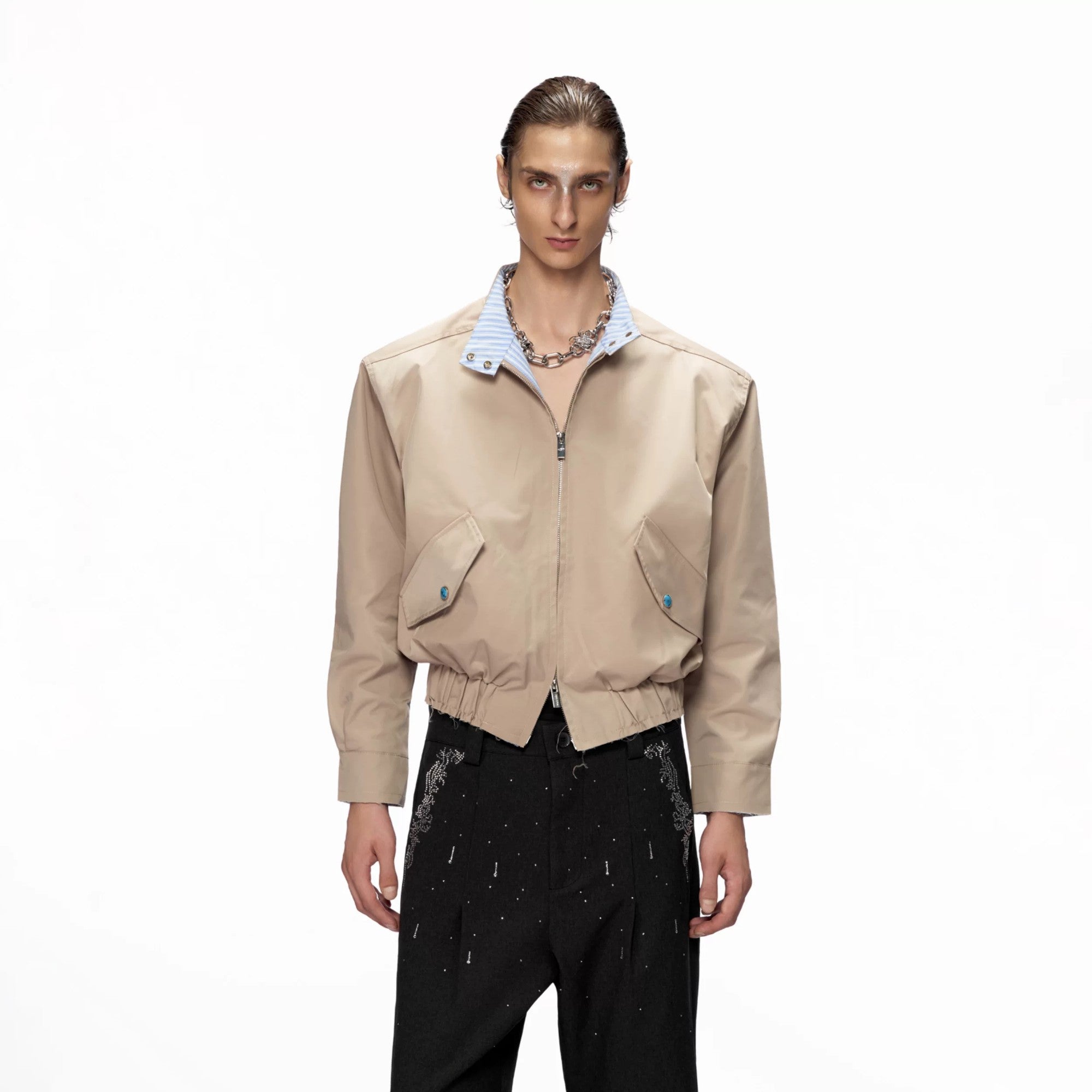 Front view of a black cropped stand collar jacket with striped details