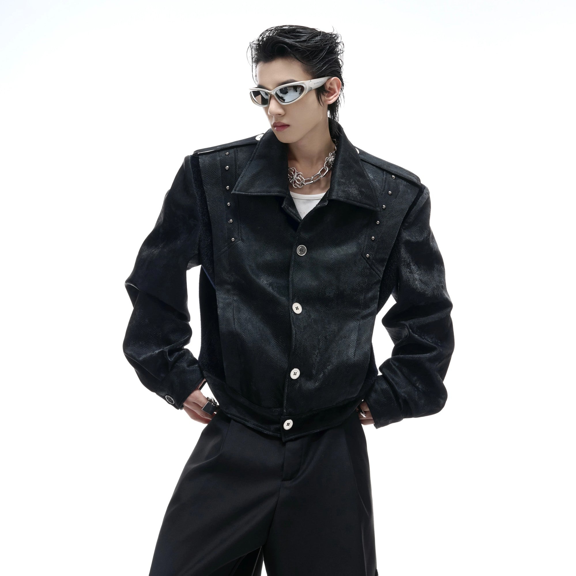 Back view showing intricate thorn embroidery and silver studs