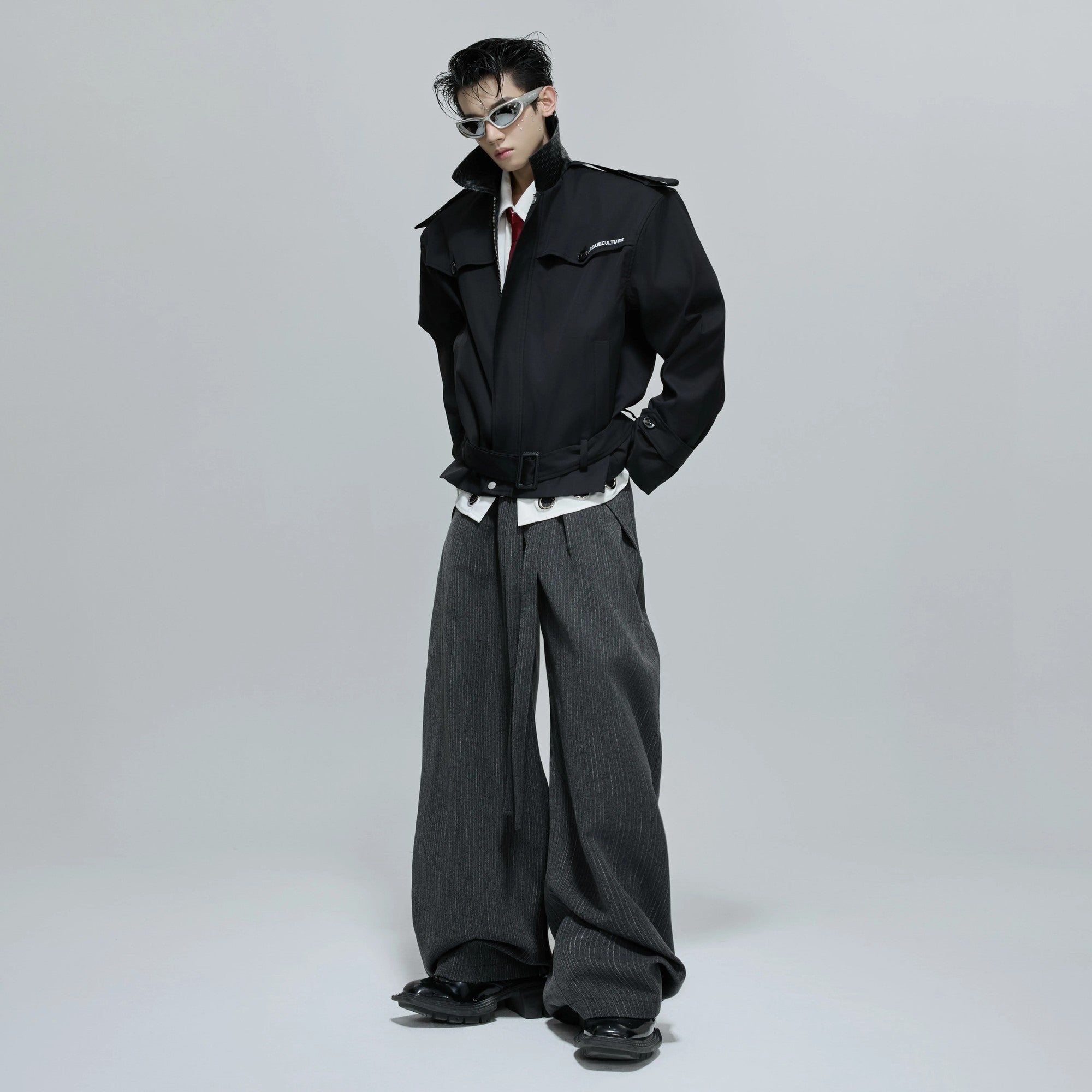 Model wearing the red khaki patchwork jacket in an urban street setting.