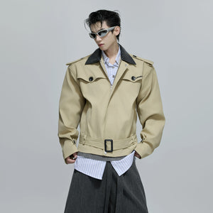 Flat lay of the short windbreaker jacket with streetwear accessories.