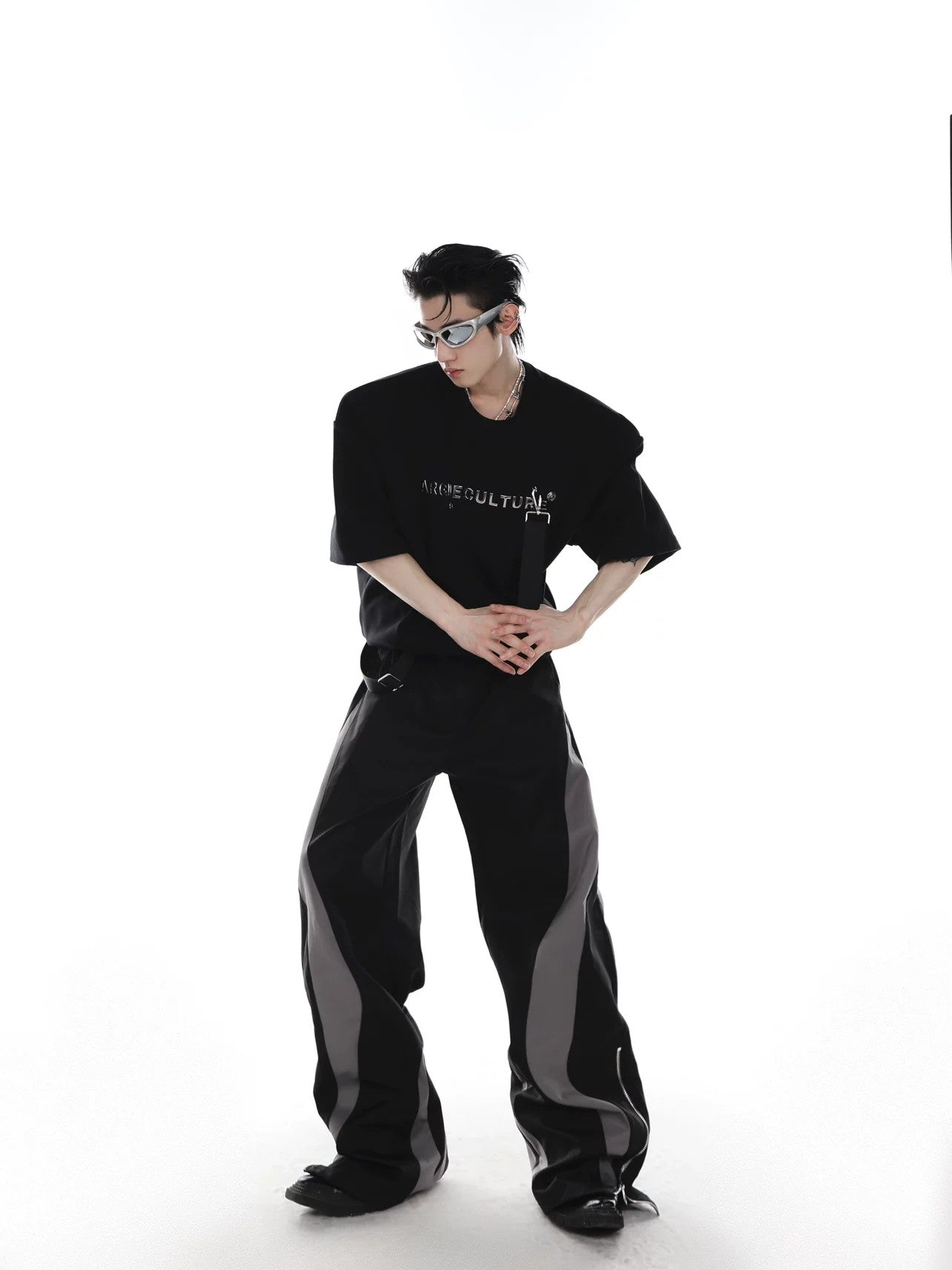 Side profile showing the structured padded shoulder and loose fit silhouette