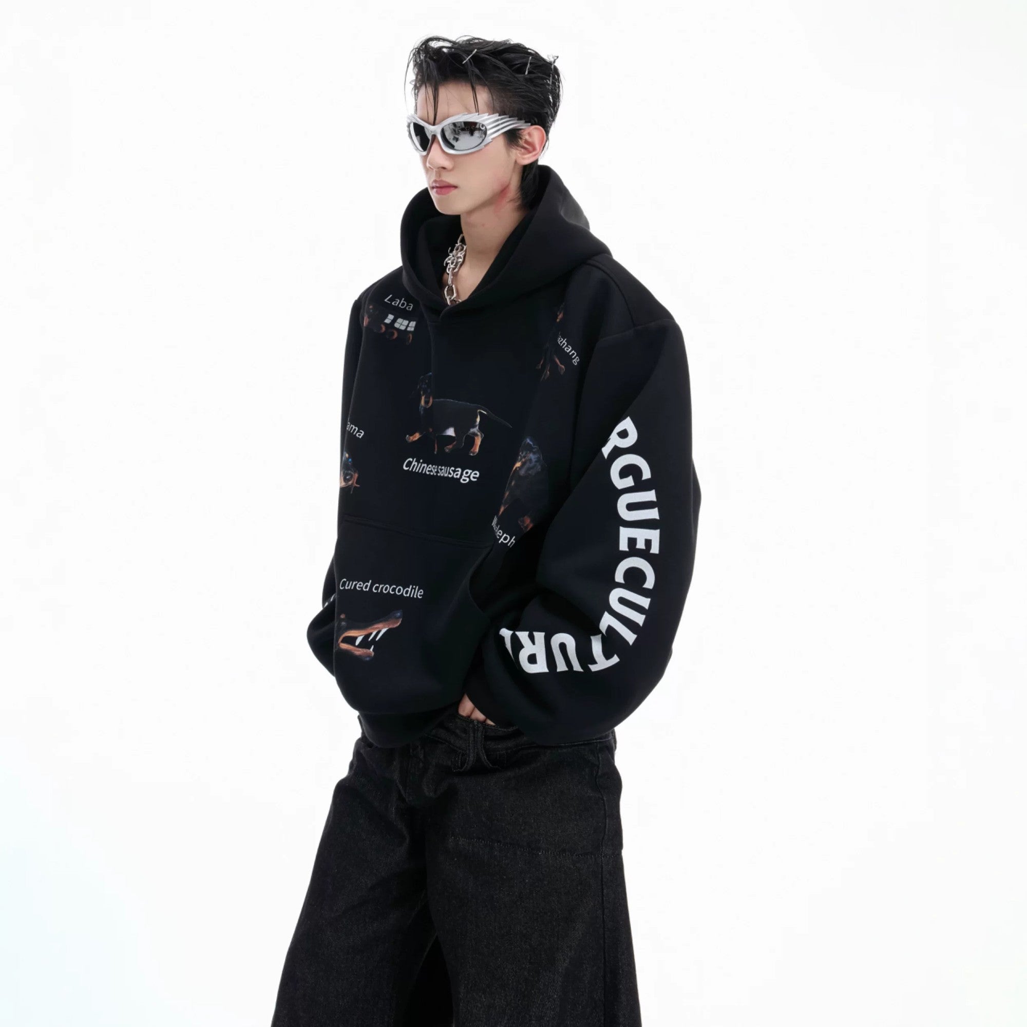 Front view of black cropped hoodie with abstract dachshund graphic.