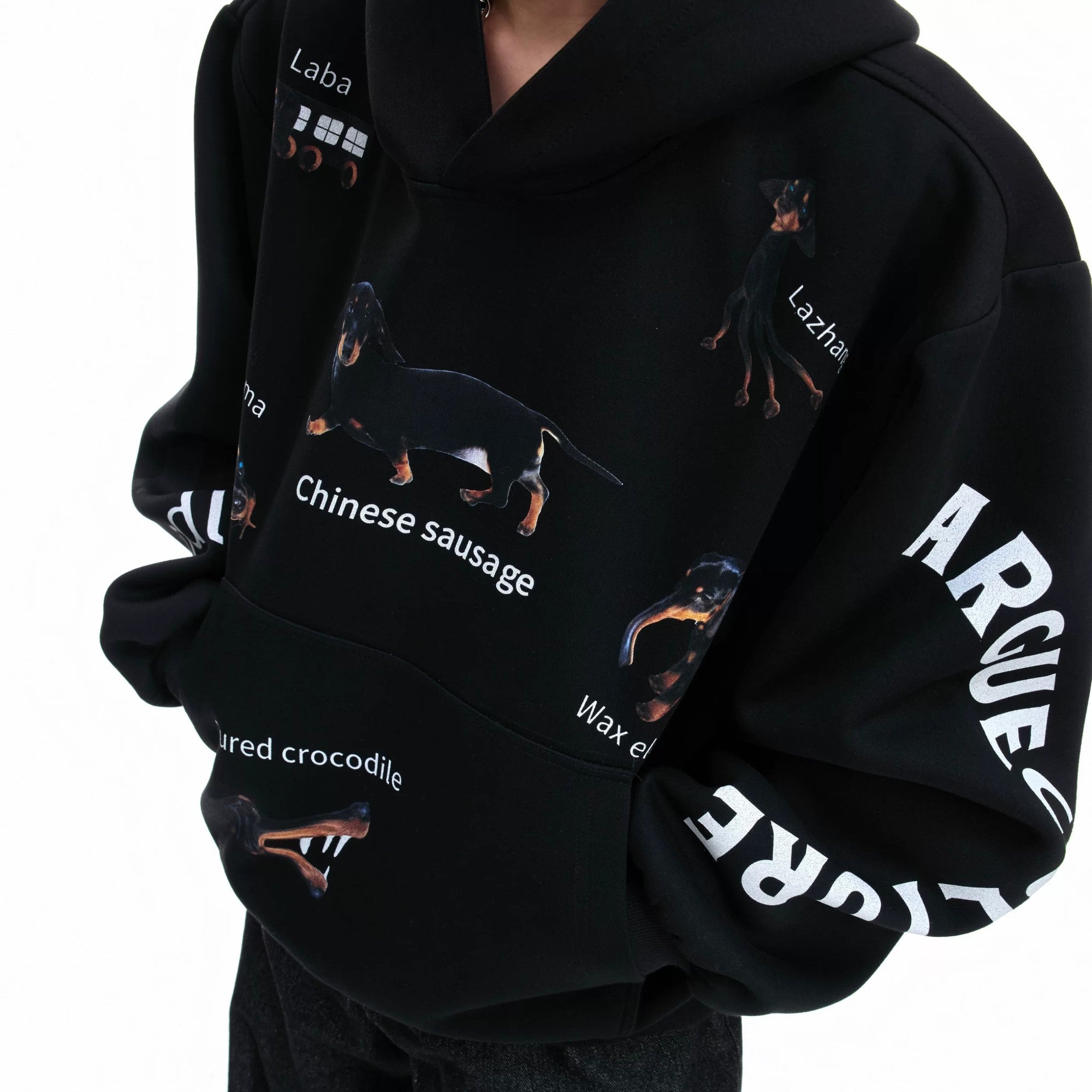 Back view of loose fit streetwear hoodie in premium black cotton.