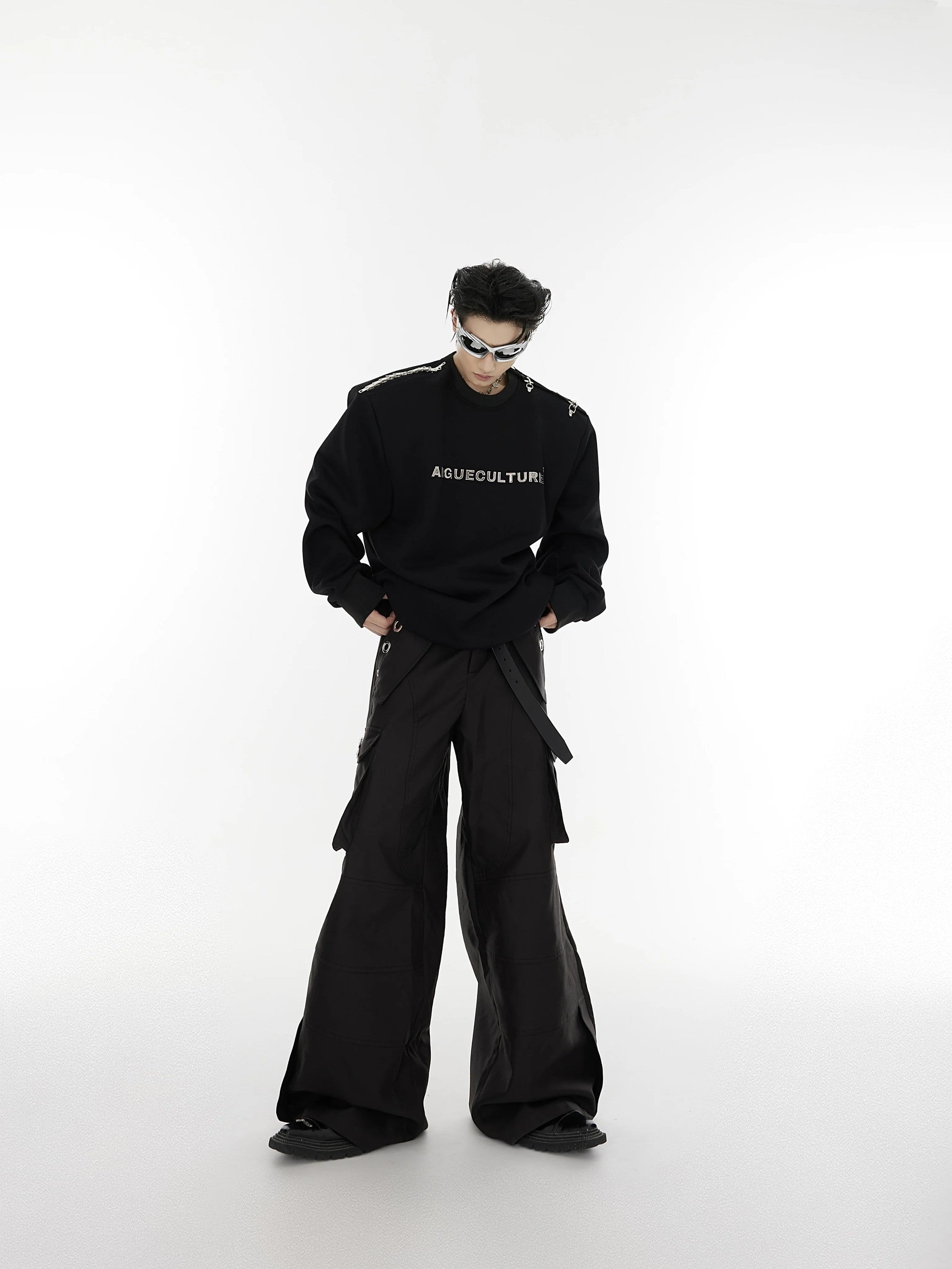Male model wearing black oversized deconstructed crewneck