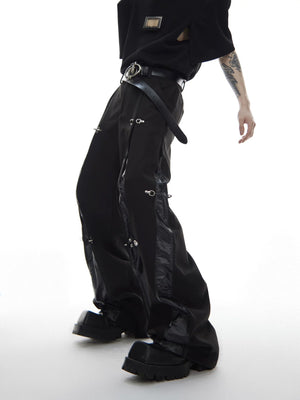 Side profile of straight leg pants showing leather design details