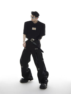 Fashion model wearing black punk style deconstructed trousers