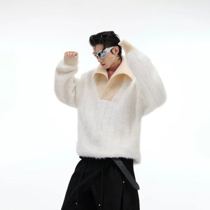 Close up detail of the white buttoned turtleneck and knit texture