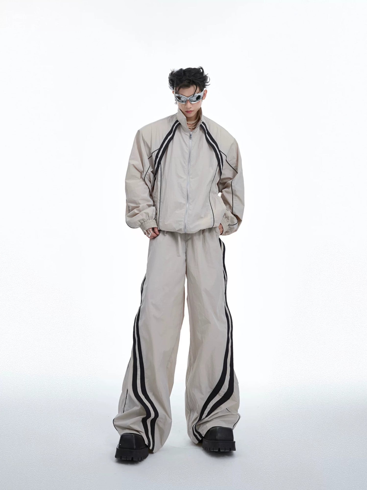 Black deconstructed techwear jacket and pants set with white contrast lines