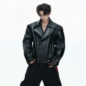 Back view of the short cropped deconstructed leather jacket with patchwork