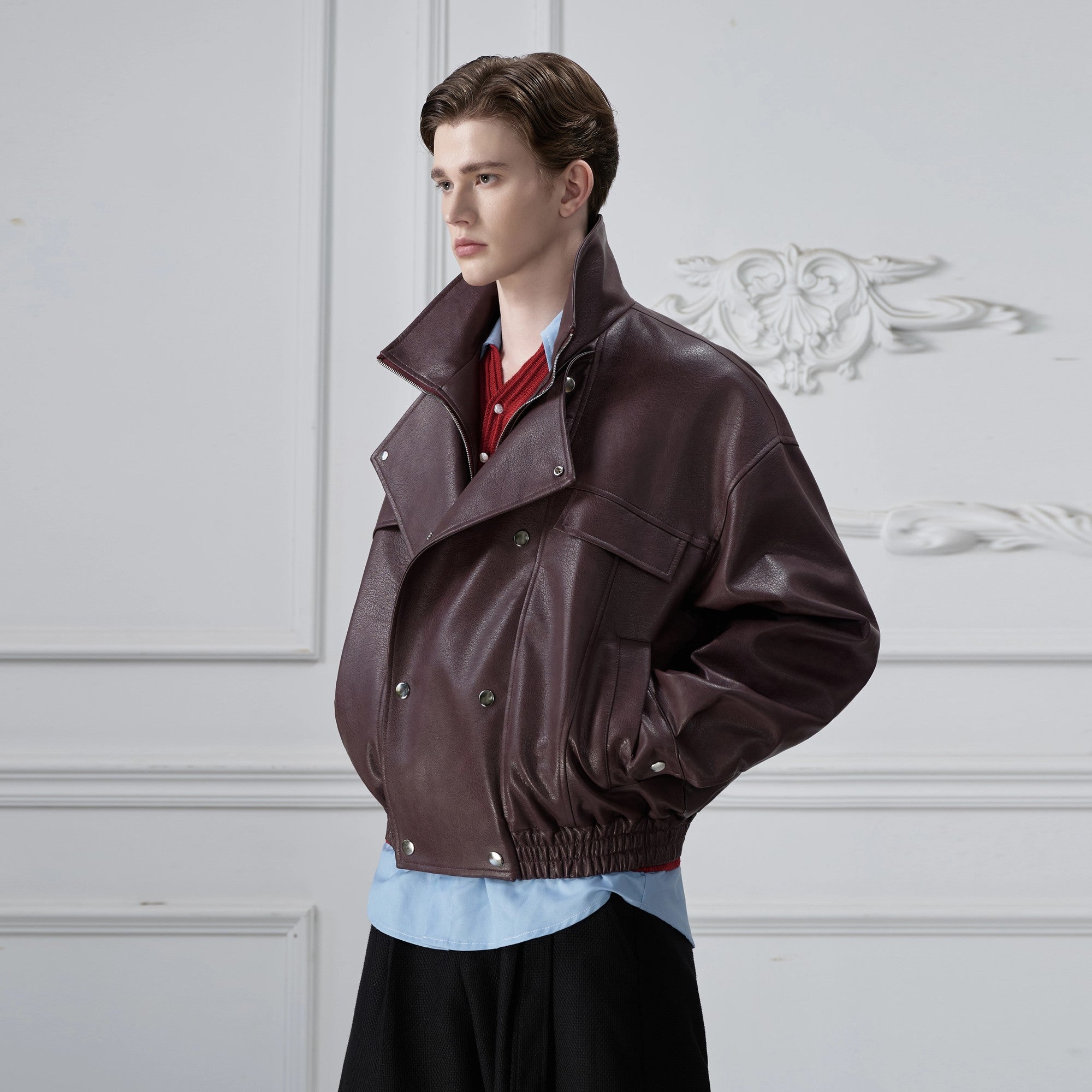 Front view of the deconstructed cropped leather jacket in urban brown