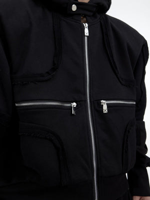 Back view of deconstructed hoodie showing 3D cutting and exposed seams