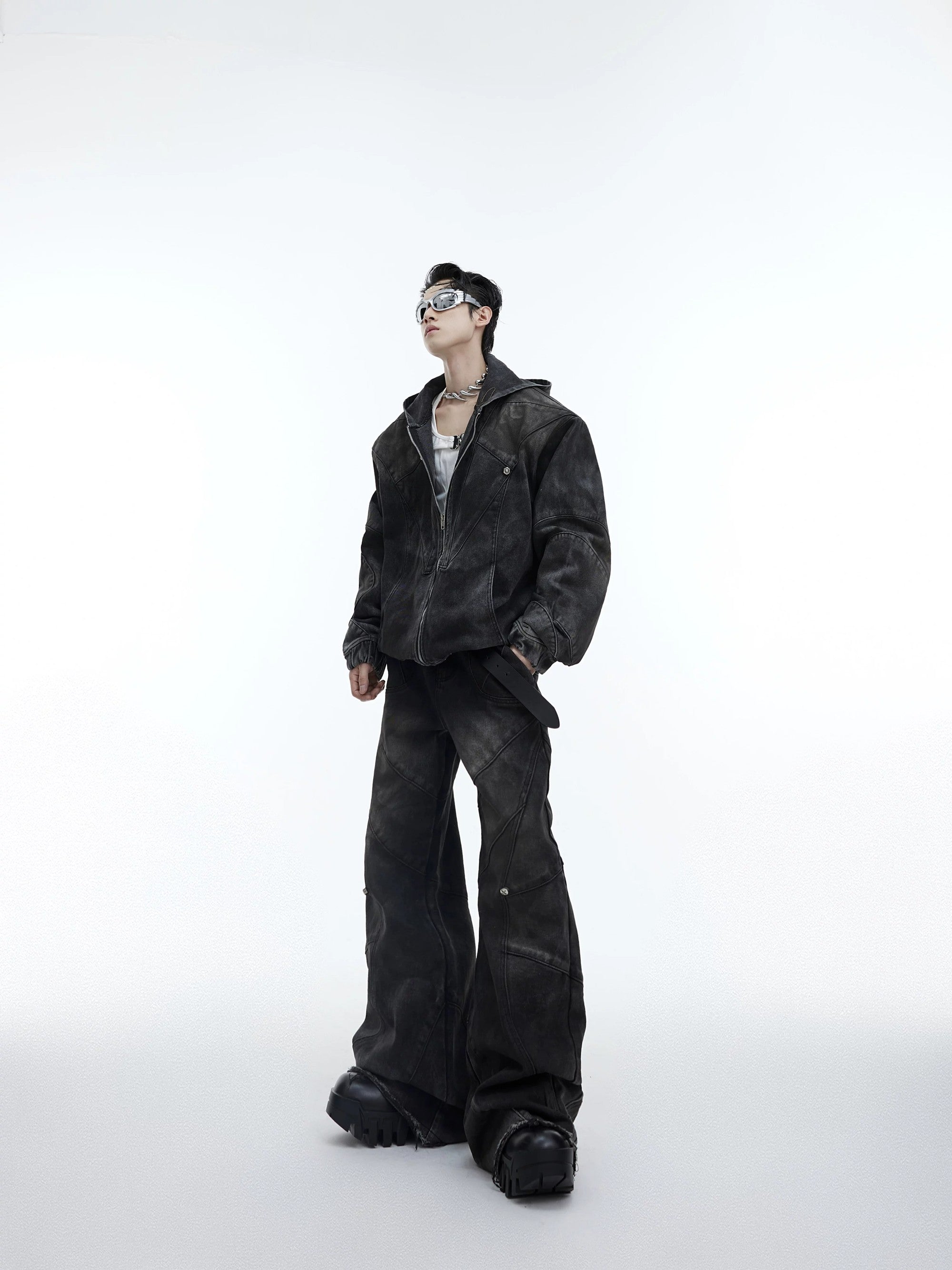 Front view of men's deconstructed distressed denim jacket in faded black