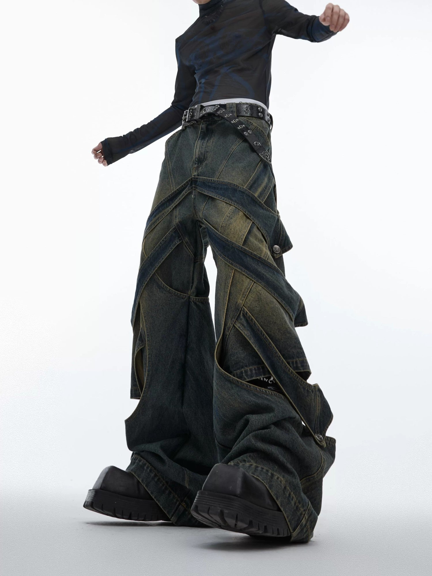 Front view of deconstructed distressed wide-leg denim cargo pants in blue