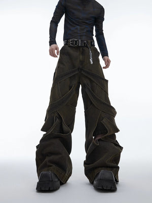 Close-up of hand-distressed cutout details on denim pants