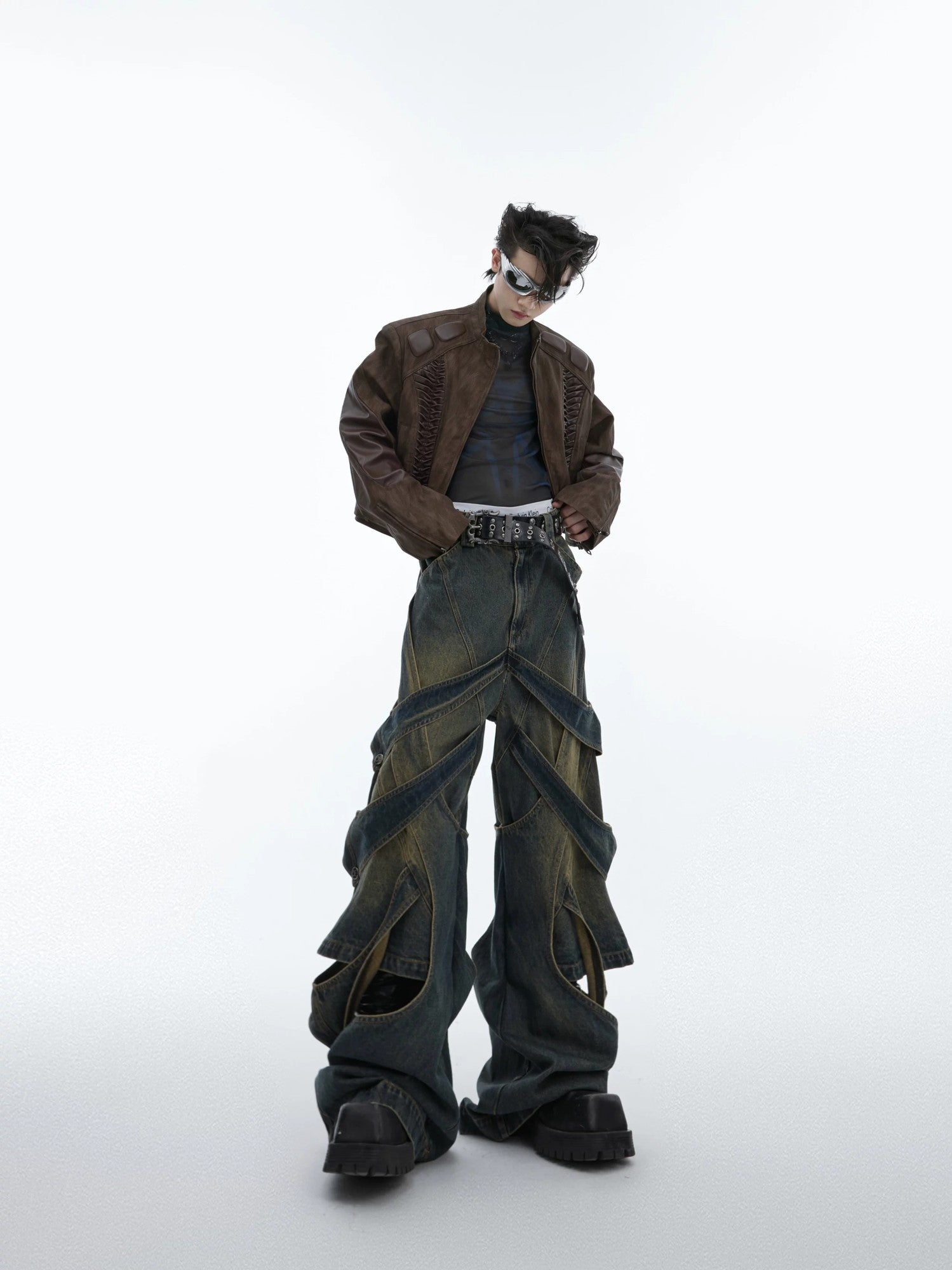 Back view of baggy wasteland style denim pants with vintage wash