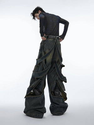 Model wearing blue deconstructed wide-leg denim pants in a street setting