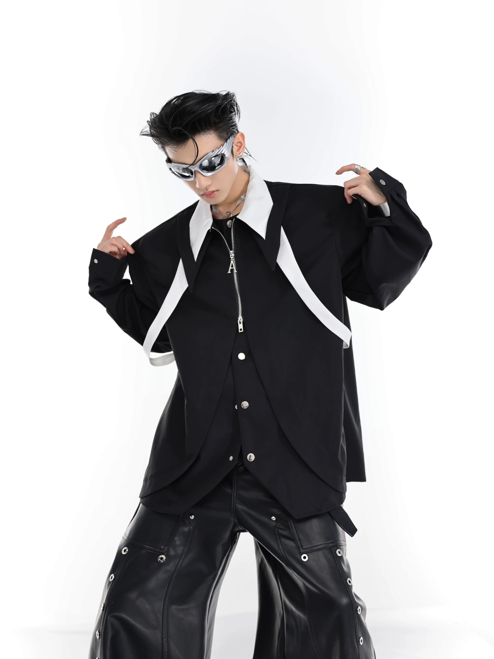 Model wearing a black deconstructed cardigan shirt for urban style