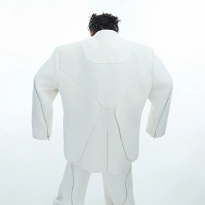 Side view of a premium deconstructed jacket showing the structured silhouette
