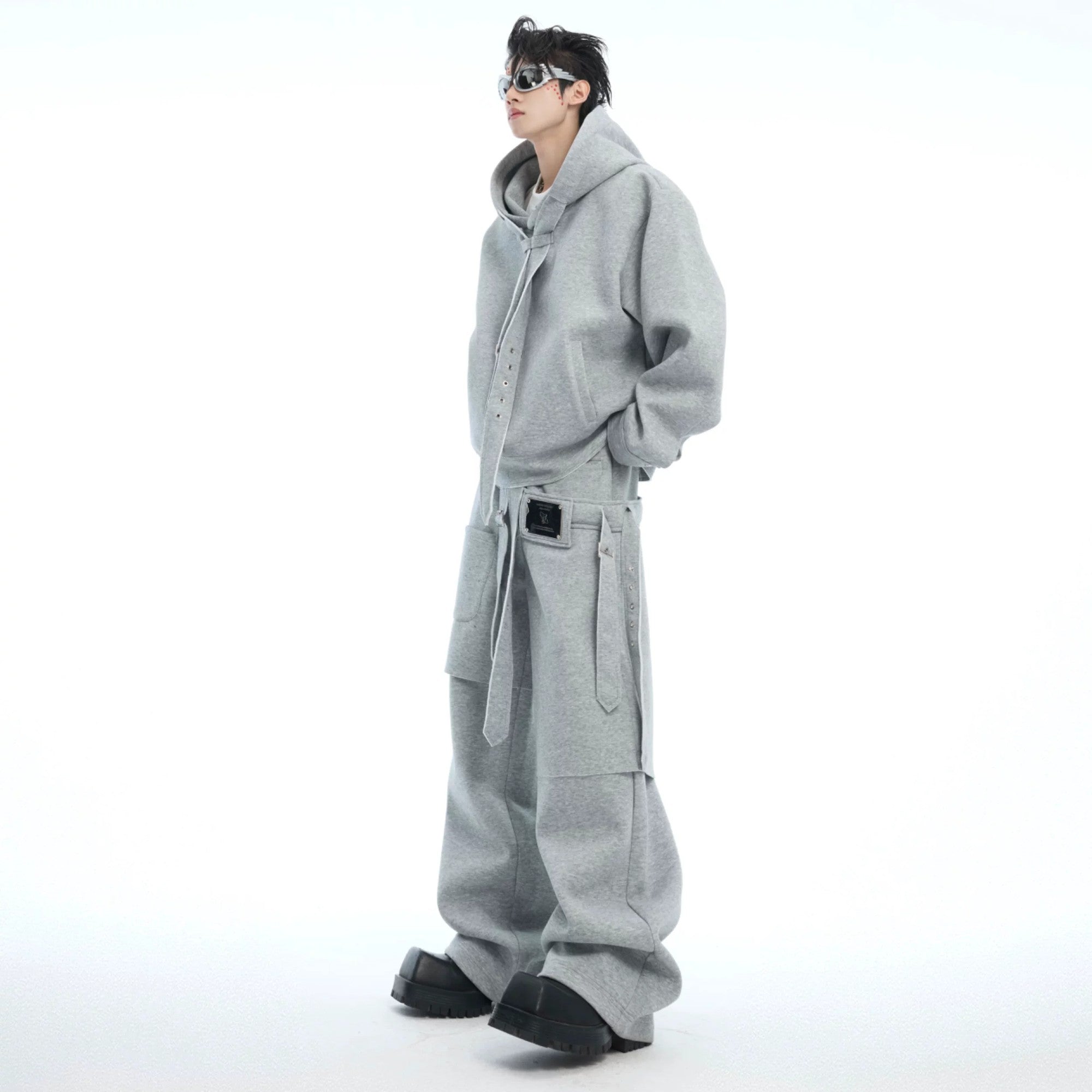 Close up of gray deconstructed ribbon detailing on streetwear hoodie