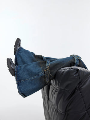 Side profile of vintage washed flare jeans showing the 3D tailored fit.